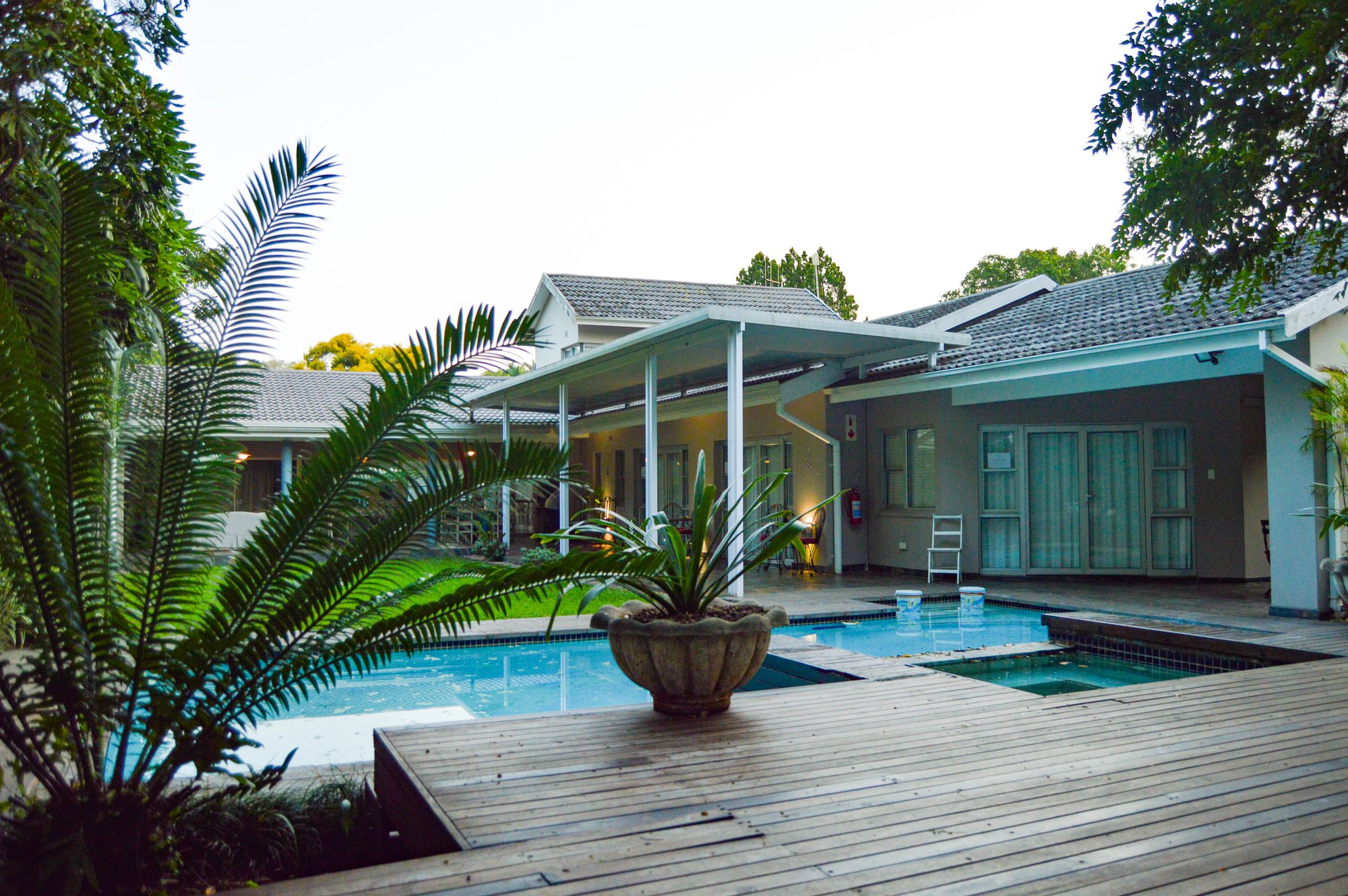 Yellowwoods Bed & Breakfast in Empangeni seen across the lawn and swimming pool in the late afternoon